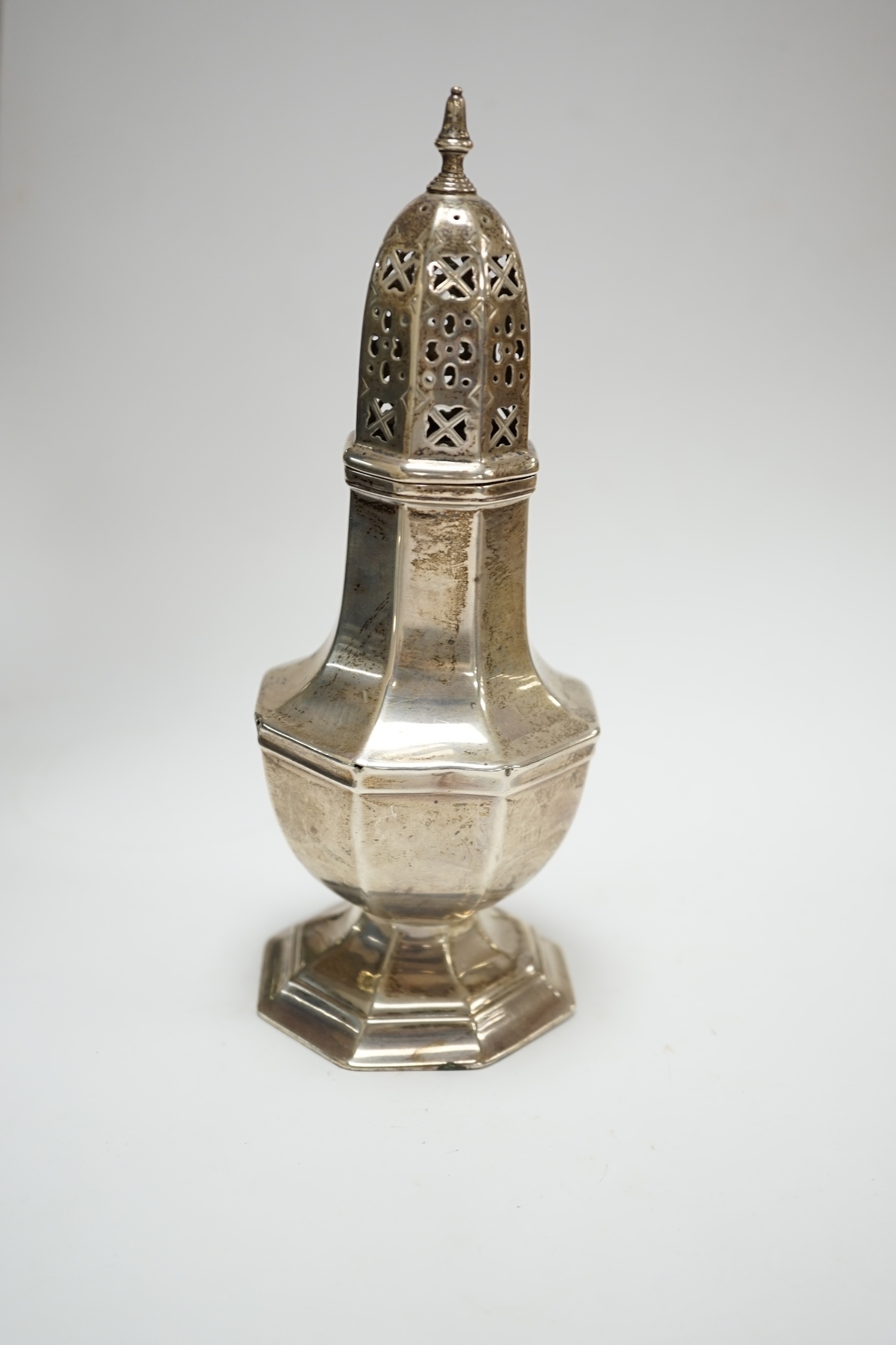 A George V silver octagonal sugar caster, Birmingham, 1932, 18.1cm, 4.7oz. Condition - poor to fair